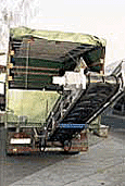 Swing-up truck-unloading conveyor 